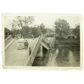 Exploded bridge with Wehrmacht car on it 